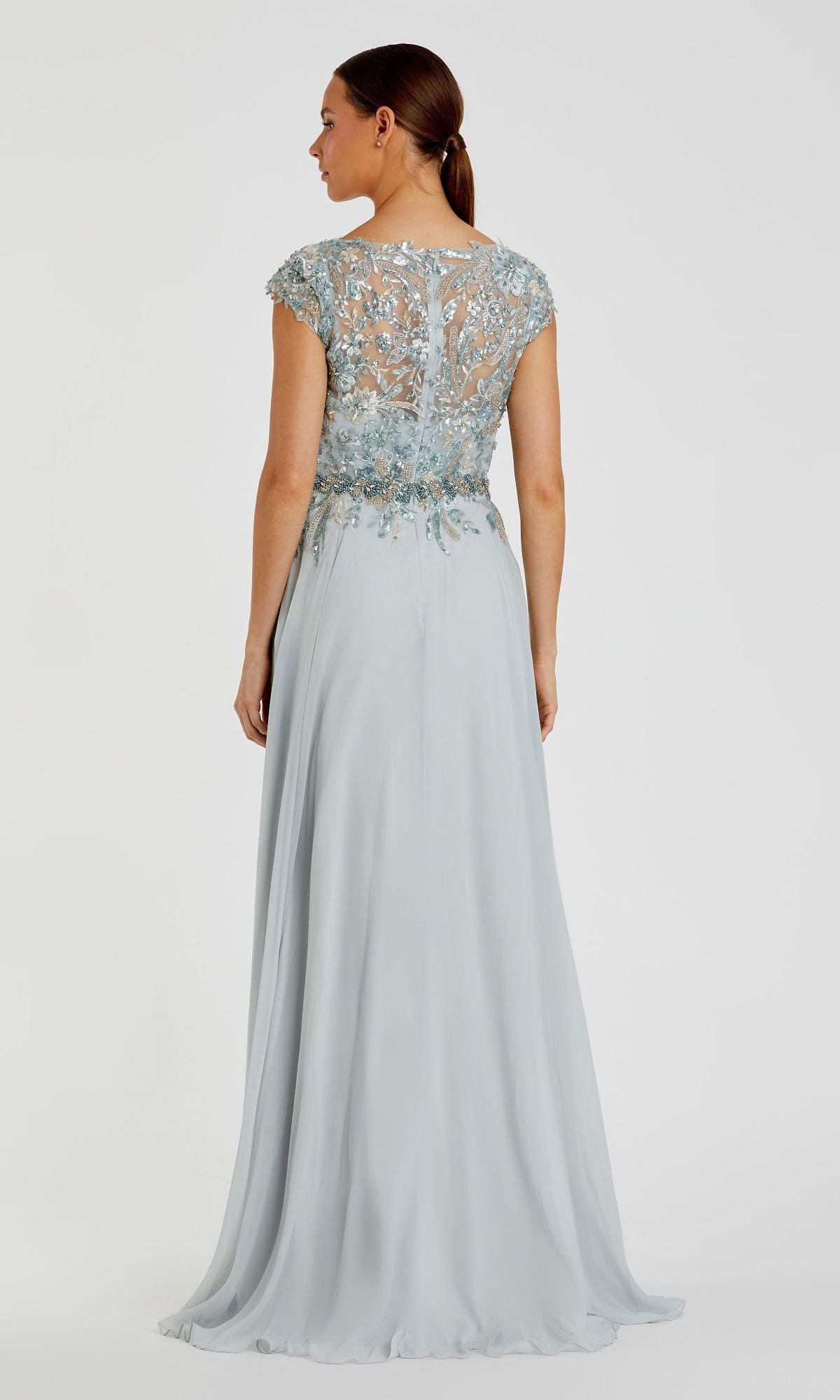 Woman in the Cap-Sleeve Long Formal Dress (Mac Duggal 79365) with an embellished sheer bodice and cap sleeves, shown from the back against a plain background.